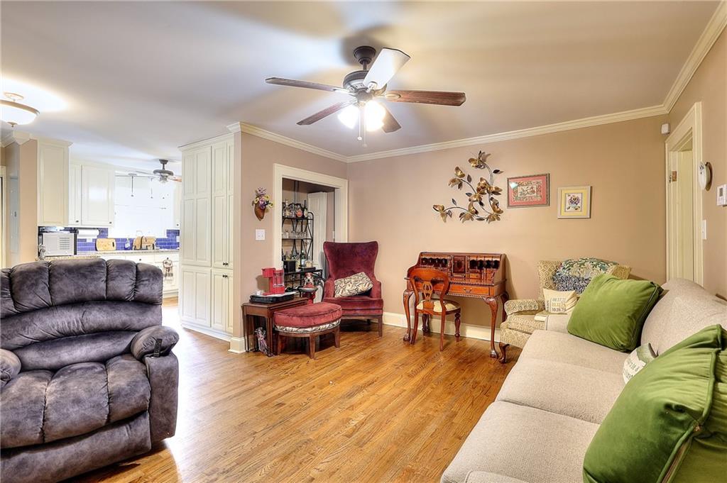 317 North Cherokee Road Social Circle, GA 30025 - Photo 14 of 32 a living room with furniture and a wooden floor