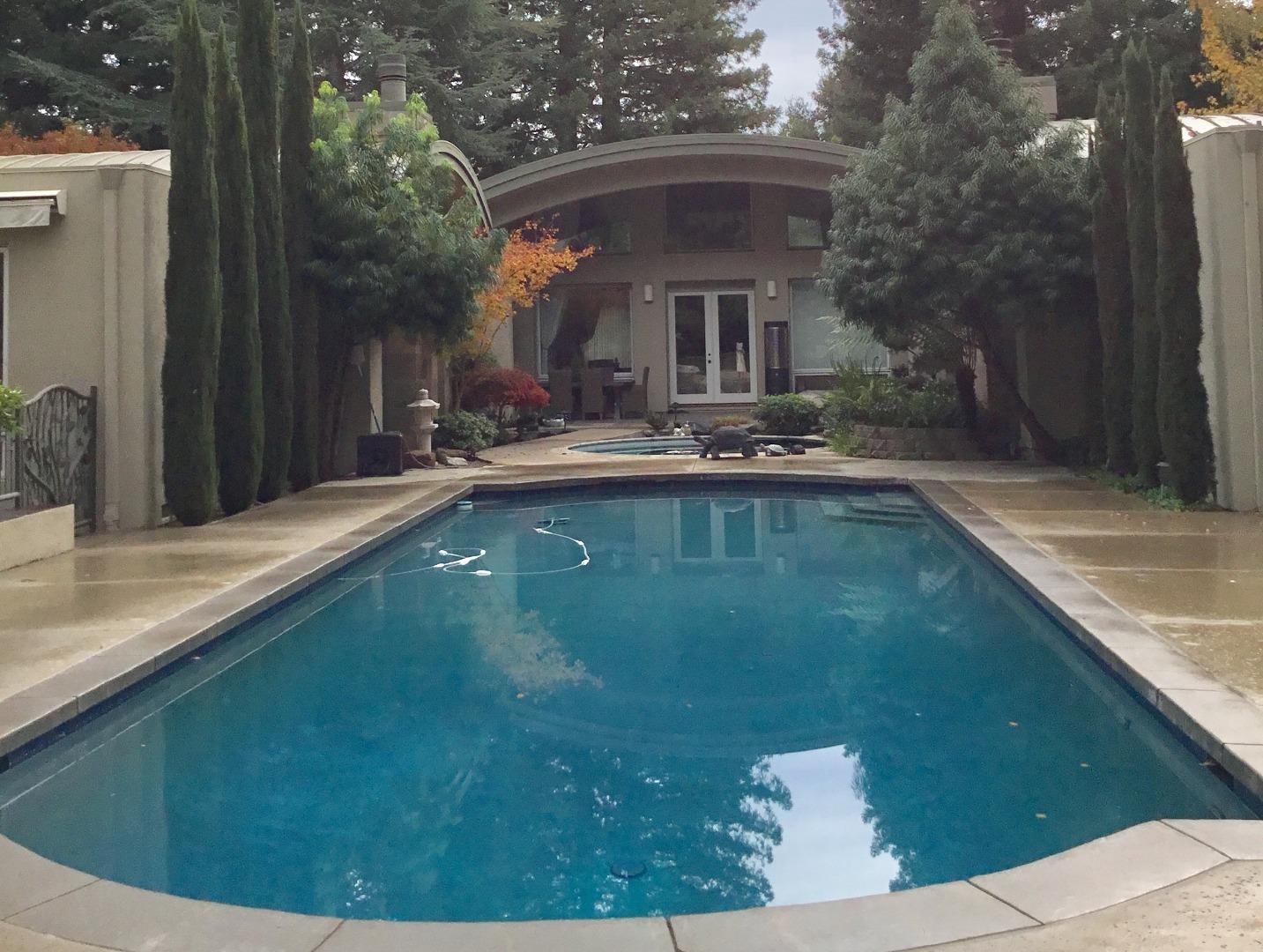 126 Atherton Avenue Atherton, CA 94027 - Photo 7 of 17 a view of a swimming pool with a patio