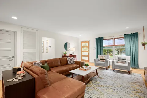 a kitchen with stainless steel appliances granite countertop a sink a stove and a refrigerator