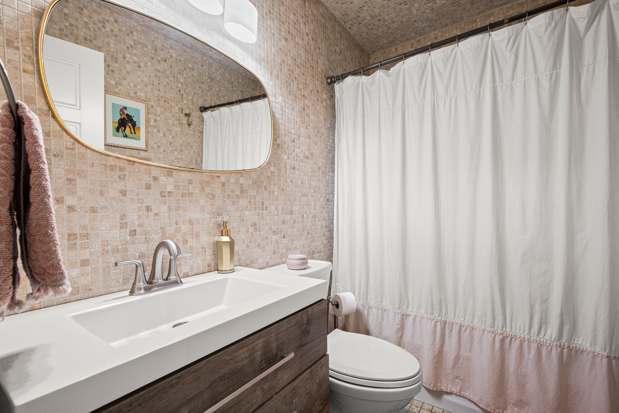 8600 Azalea Trail Austin, TX 78759 - Photo 19 of 26 a bathroom with a sink a toilet and mirror