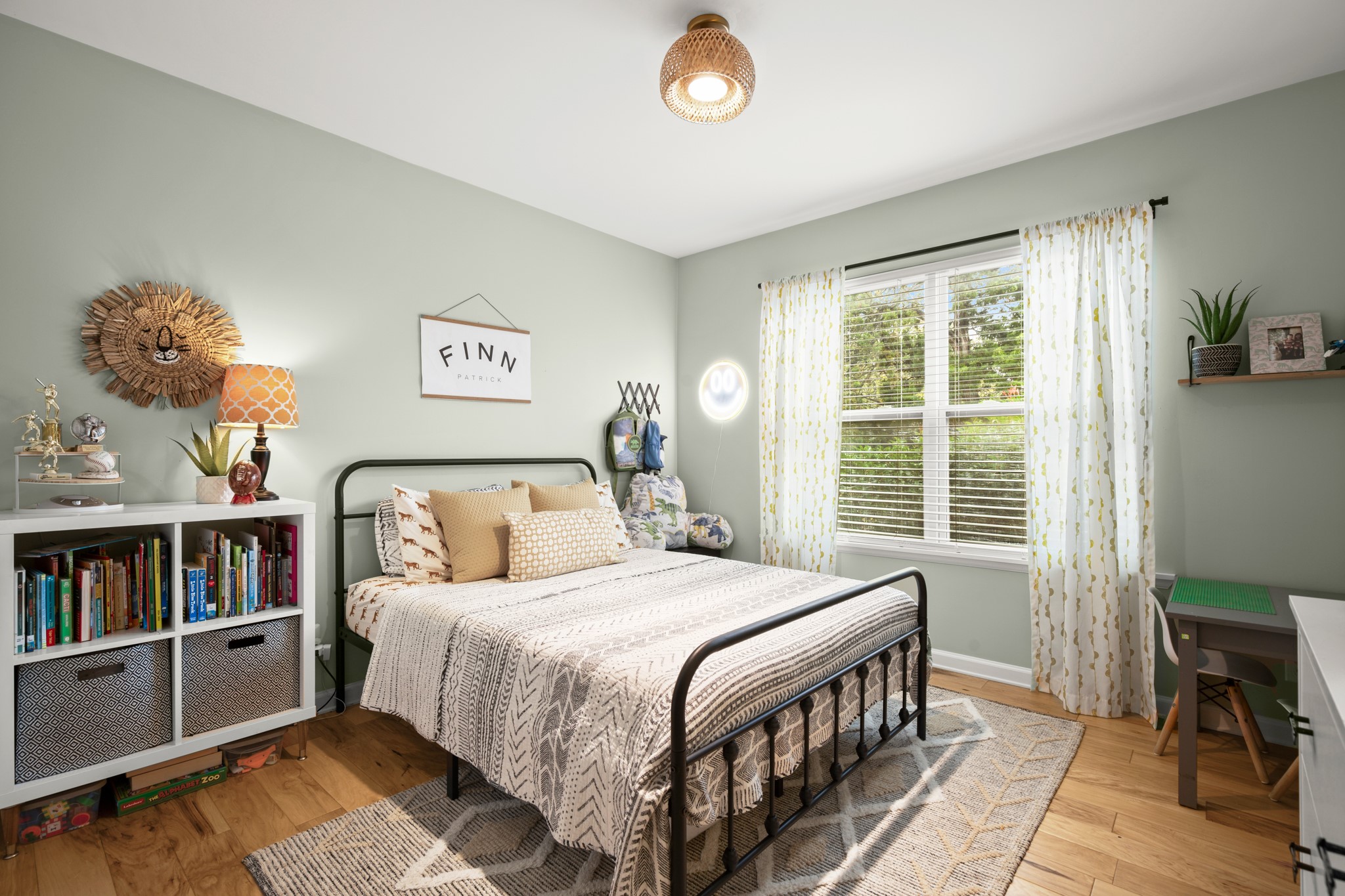 8600 Azalea Trail Austin, TX 78759 - Photo 20 of 26 a bedroom with a bed bookshelf and a window