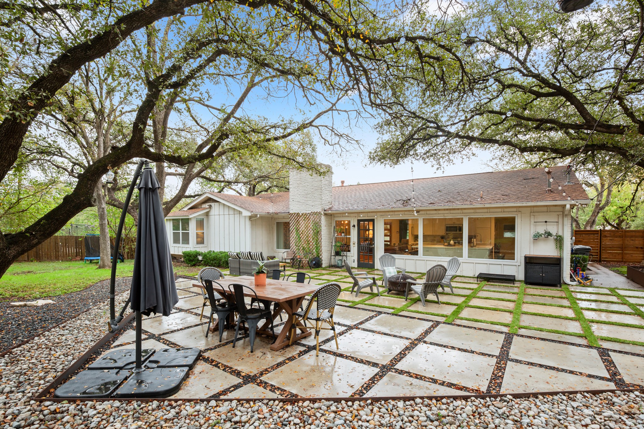 8600 Azalea Trail Austin, TX 78759 - Photo 22 of 26 a view of a house with backyard sitting area and garden