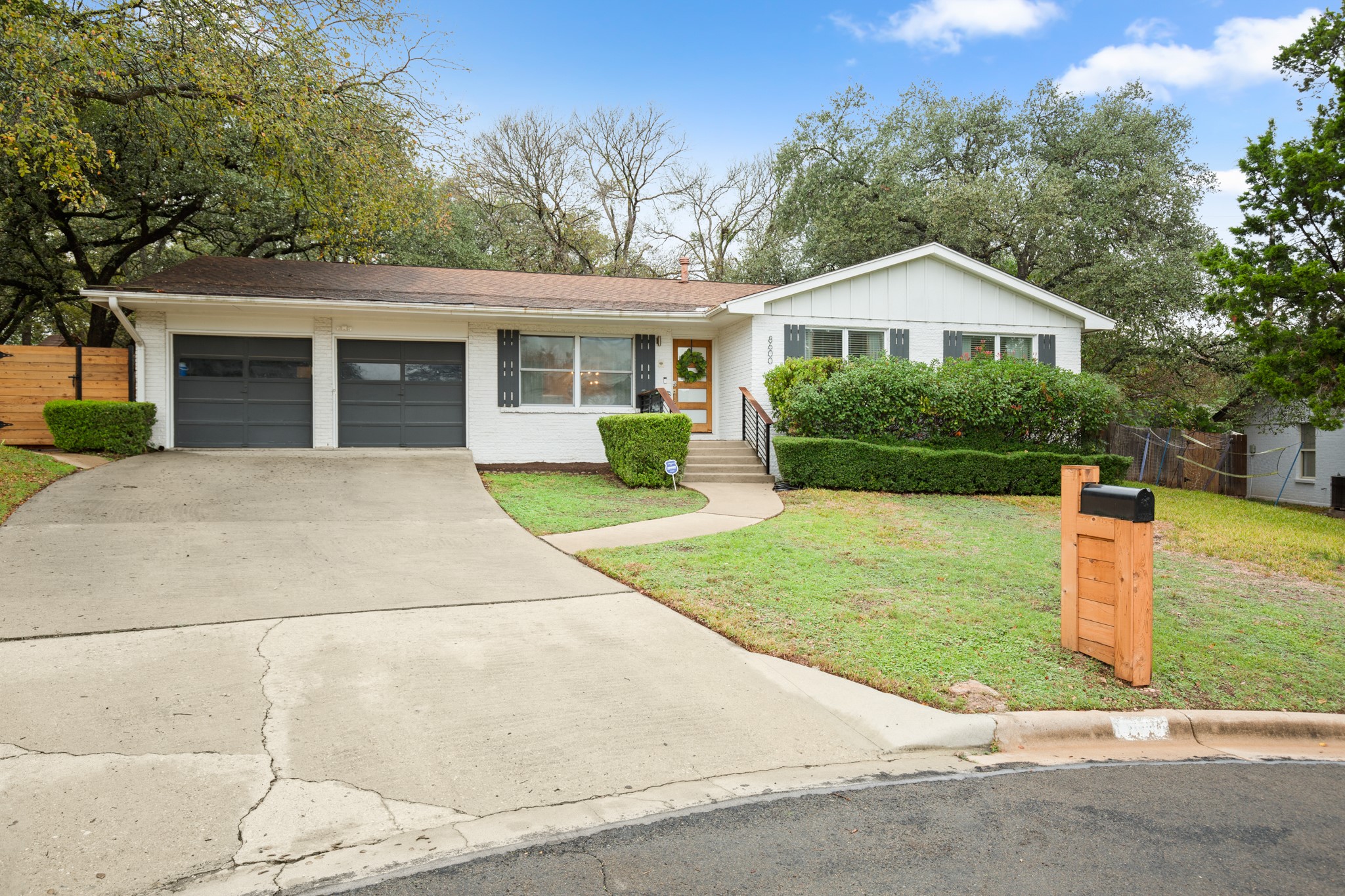 8600 Azalea Trail Austin, TX 78759 - Photo 26 of 26 a front view of a house with yard and green space