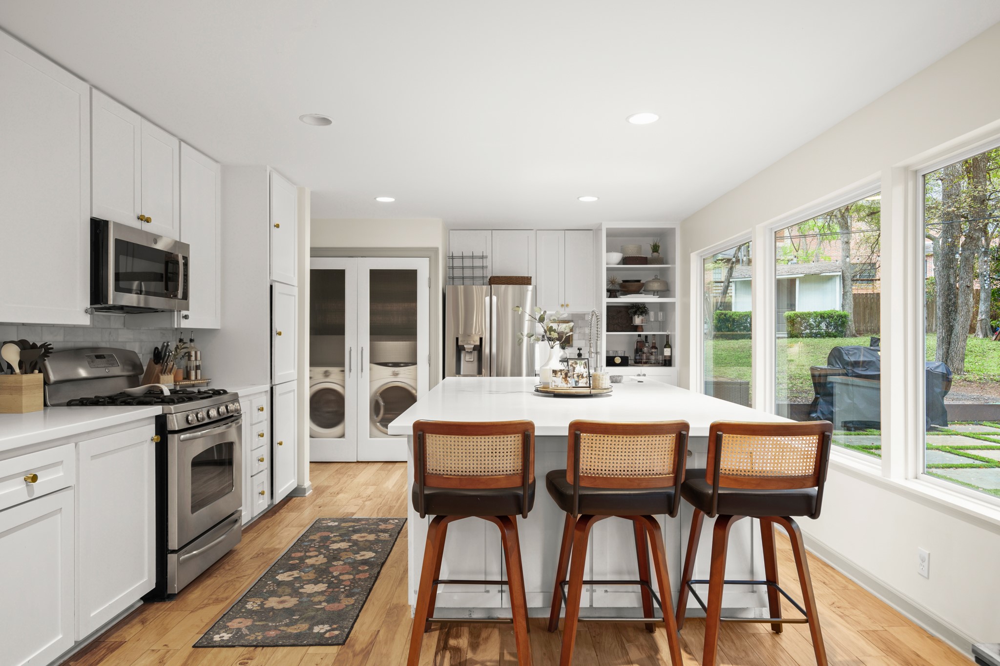 8600 Azalea Trail Austin, TX 78759 - Photo 6 of 26 a large kitchen with a table and chairs
