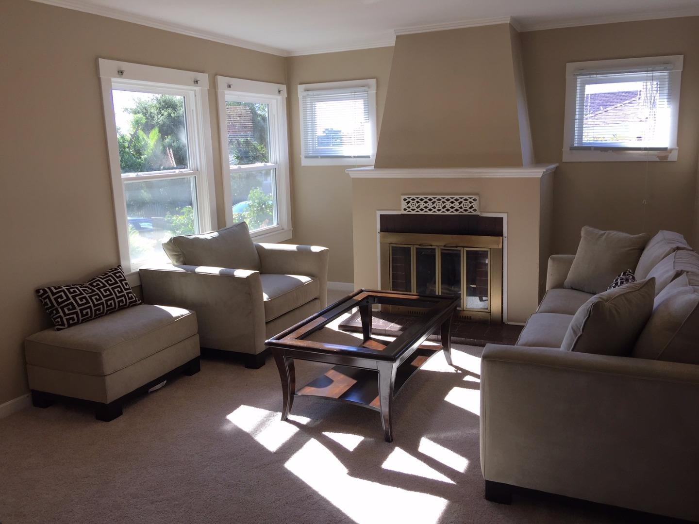 333 Brighton Road Pacifica, CA 94044 - Photo 2 of 9 a living room with furniture and a fireplace