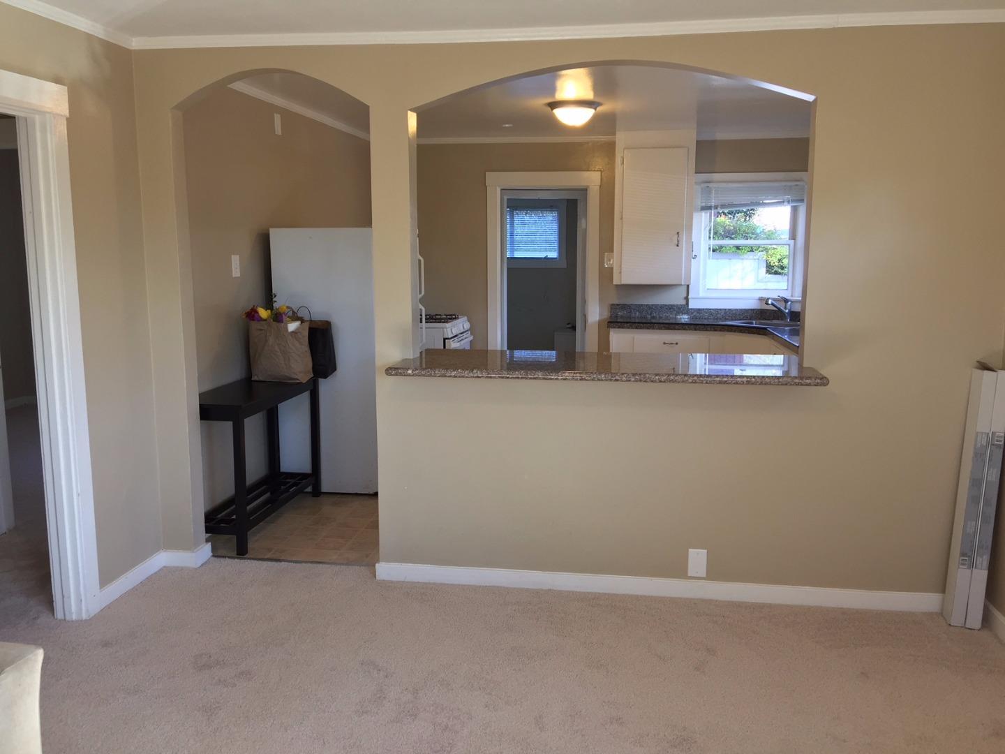 333 Brighton Road Pacifica, CA 94044 - Photo 3 of 9 an entryway and a livingroom with wooden floor