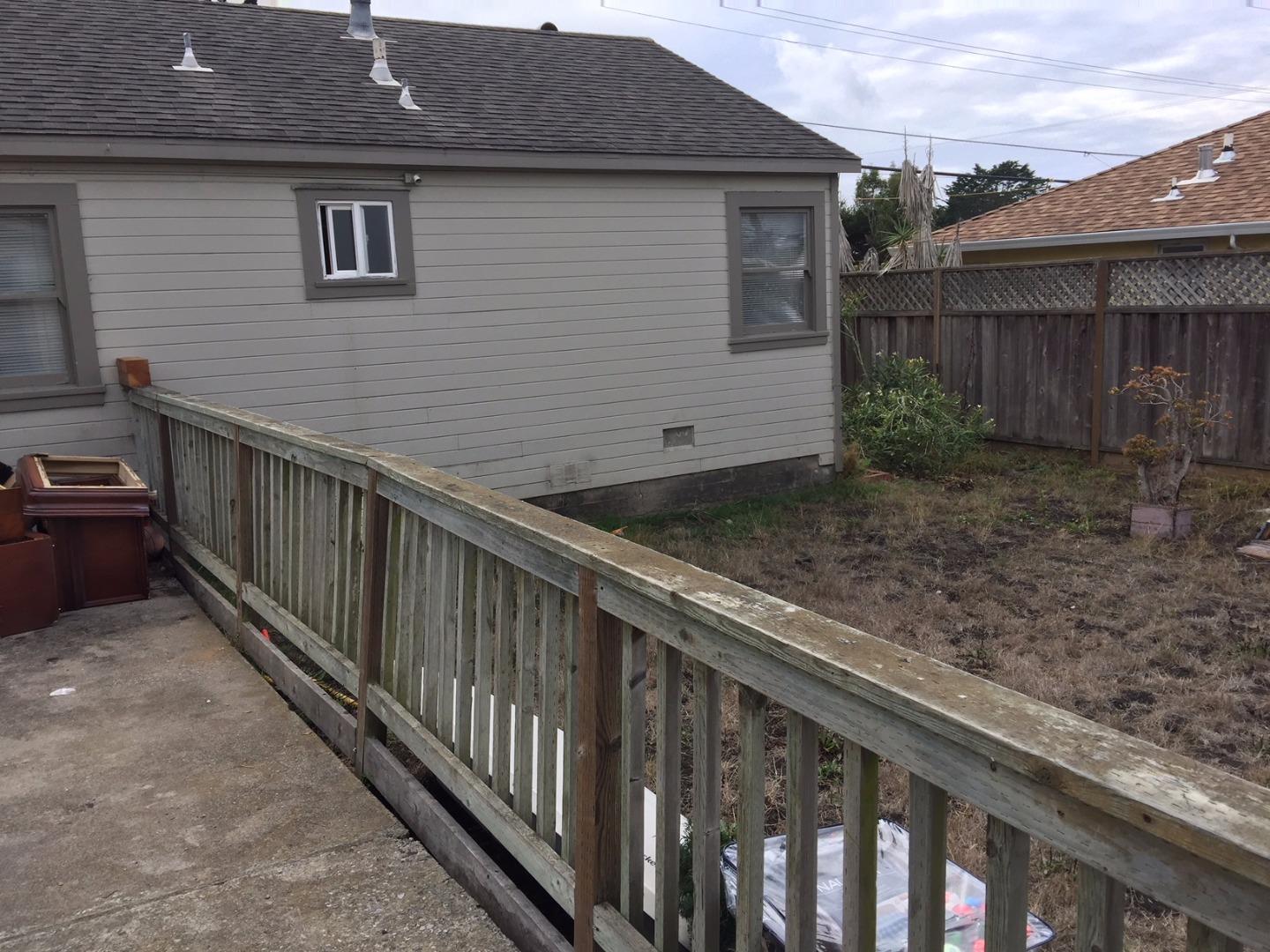 333 Brighton Road Pacifica, CA 94044 - Photo 8 of 9 a view of a house with backyard and wooden fence