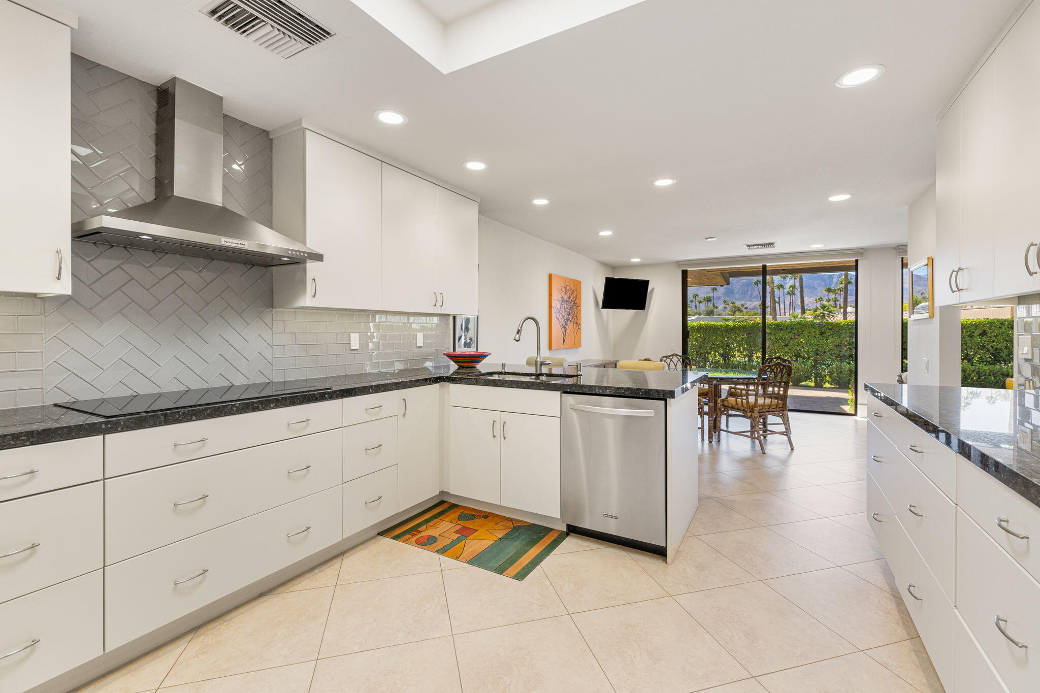 15 Reed Court Rancho Mirage, CA 92270 - Photo 23 of 53 a kitchen with stainless steel appliances granite countertop a refrigerator sink and cabinets