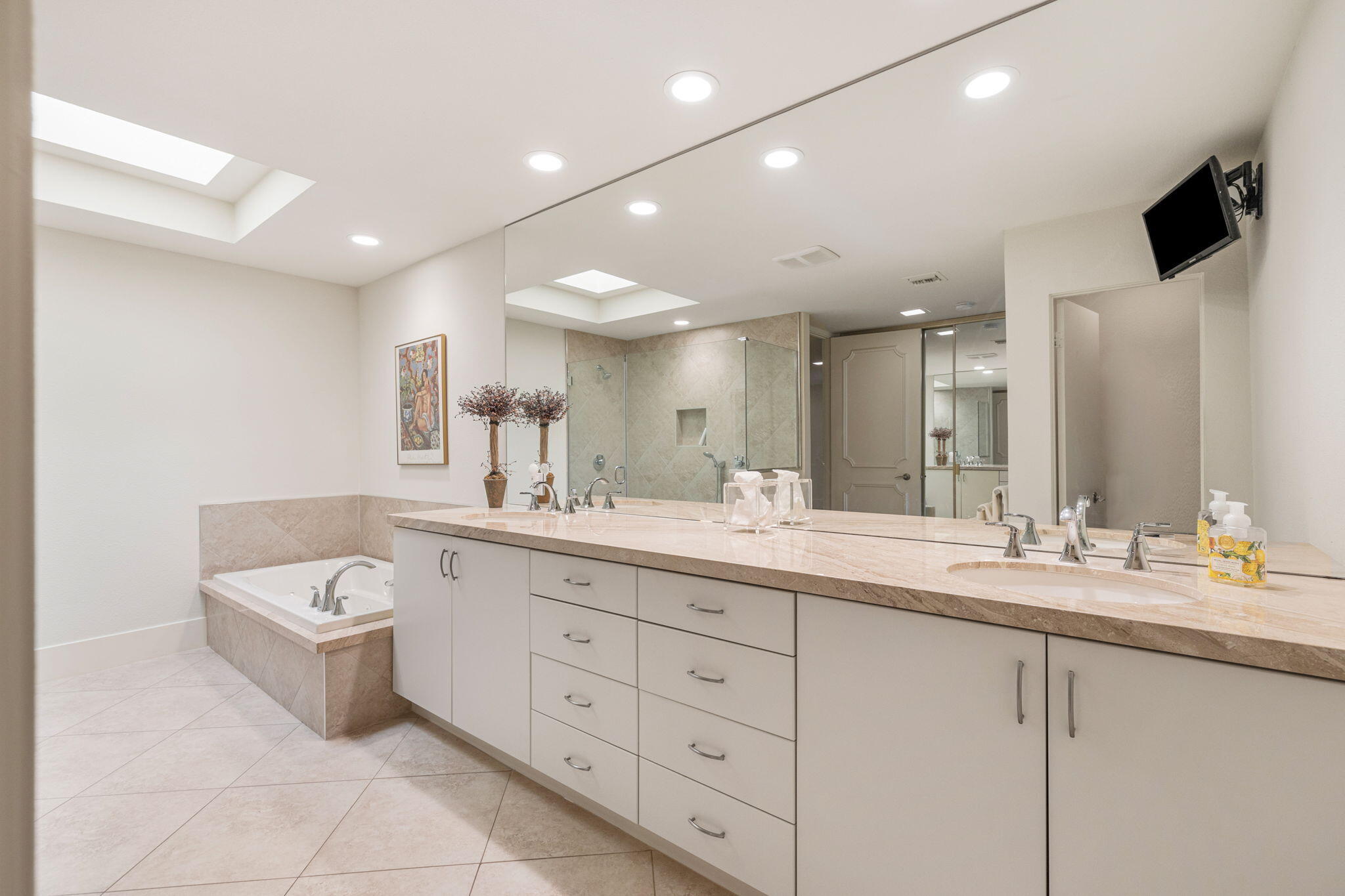 15 Reed Court Rancho Mirage, CA 92270 - Photo 31 of 53 a spacious bathroom with a double vanity sink and a mirror