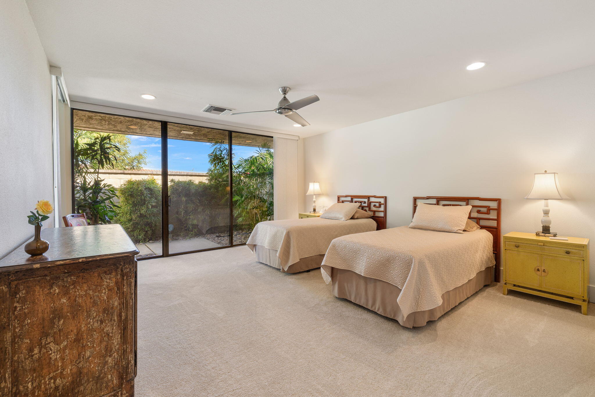 15 Reed Court Rancho Mirage, CA 92270 - Photo 35 of 53 a spacious bedroom with a bed and large window