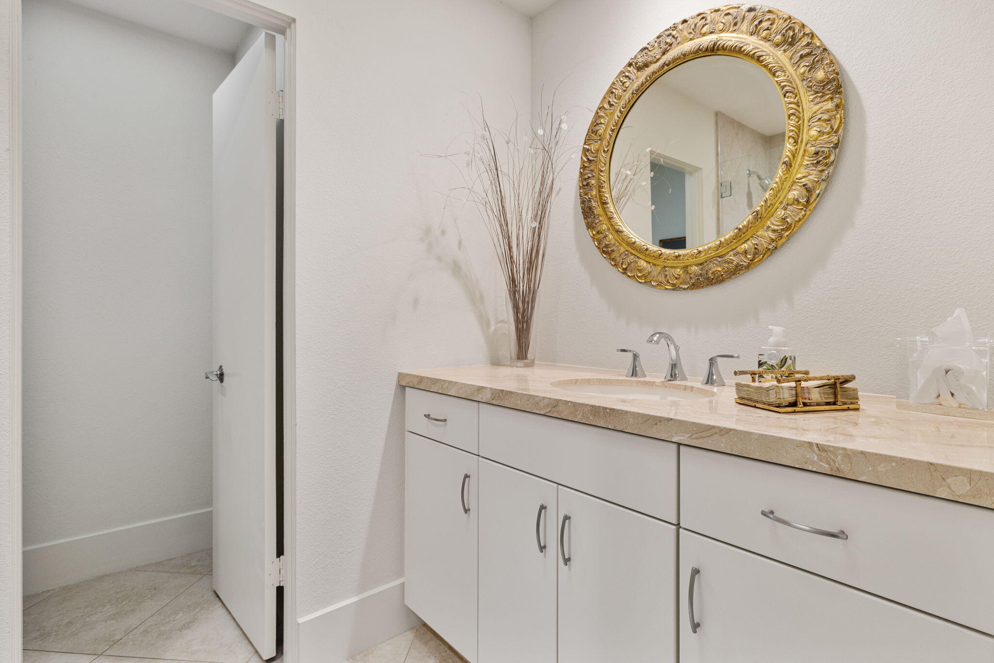 15 Reed Court Rancho Mirage, CA 92270 - Photo 42 of 53 a bathroom with a granite countertop sink and a mirror