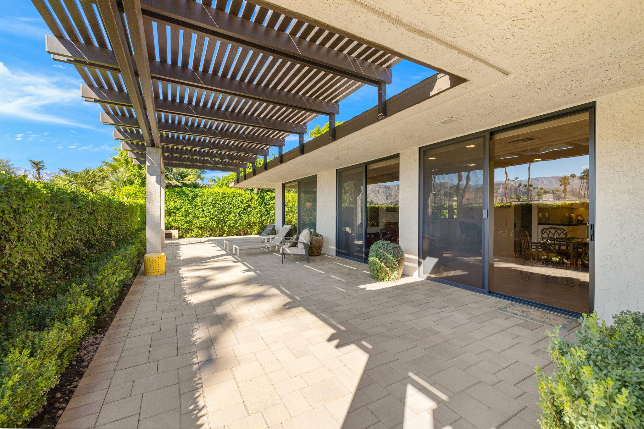 15 Reed Court Rancho Mirage, CA 92270 - Photo 46 of 53 a view of a patio with table and chairs and potted plants