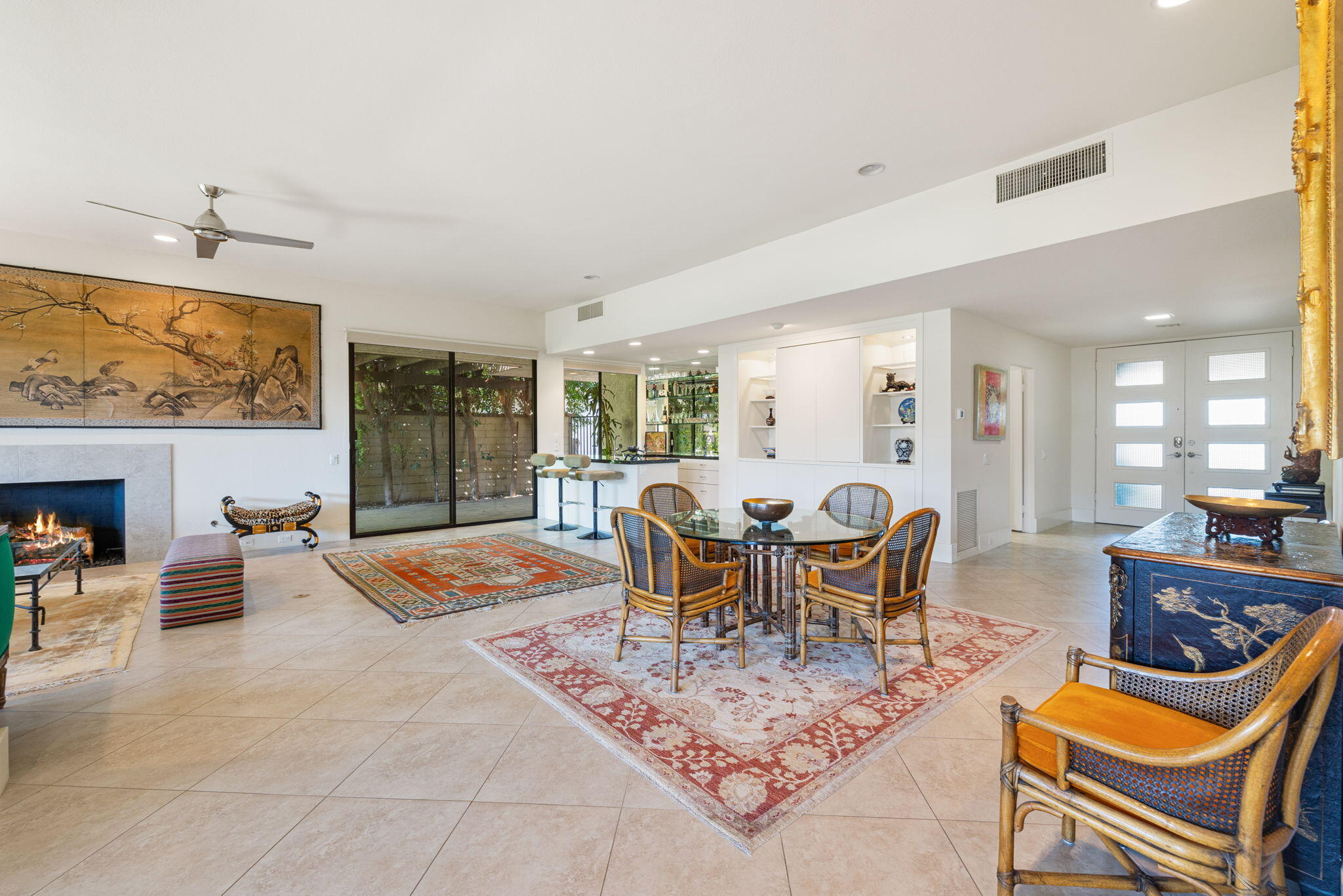 15 Reed Court Rancho Mirage, CA 92270 - Photo 10 of 53 a dining room with furniture a rug and a open kitchen view