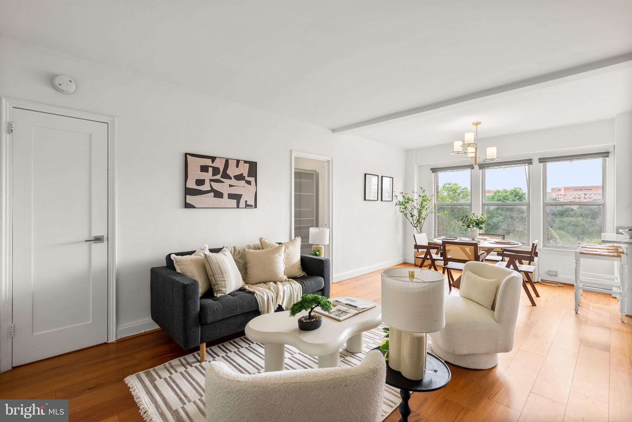2500 Q Street Northwest, Unit 524 Washington, DC 20007 - Photo 9 of 50 a living room with furniture and a large window