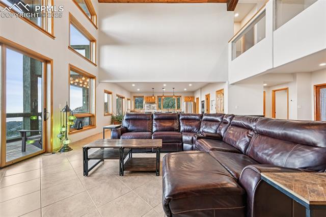 1417 Forest Road Manitou Springs, CO 80829 - Photo 8 of 50 Open concept living room with wall of windows bringing in natural light and views!!!