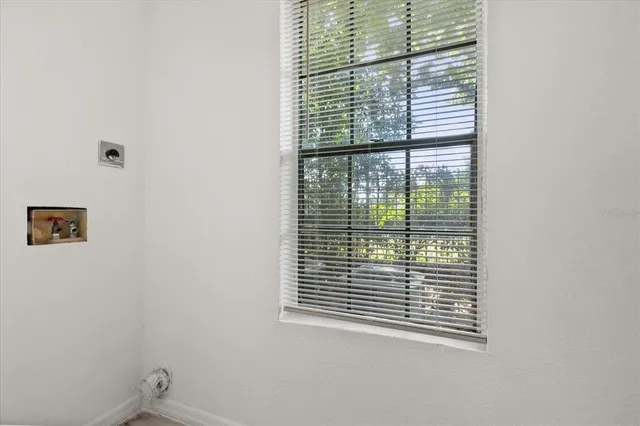 a view of a room that has a window in it