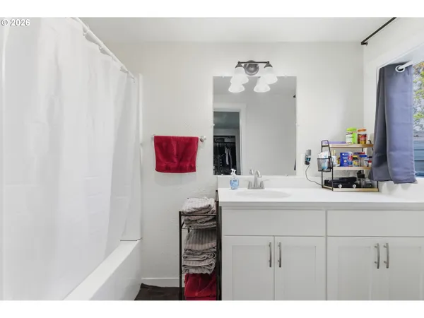 a bedroom with a bed a desk and chair