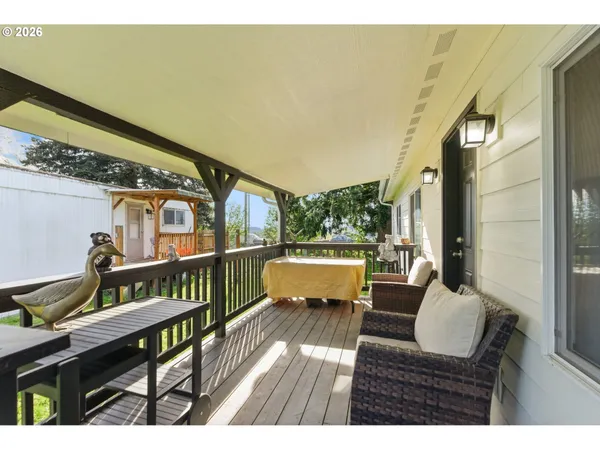 a outdoor living space with furniture and a wooden floor