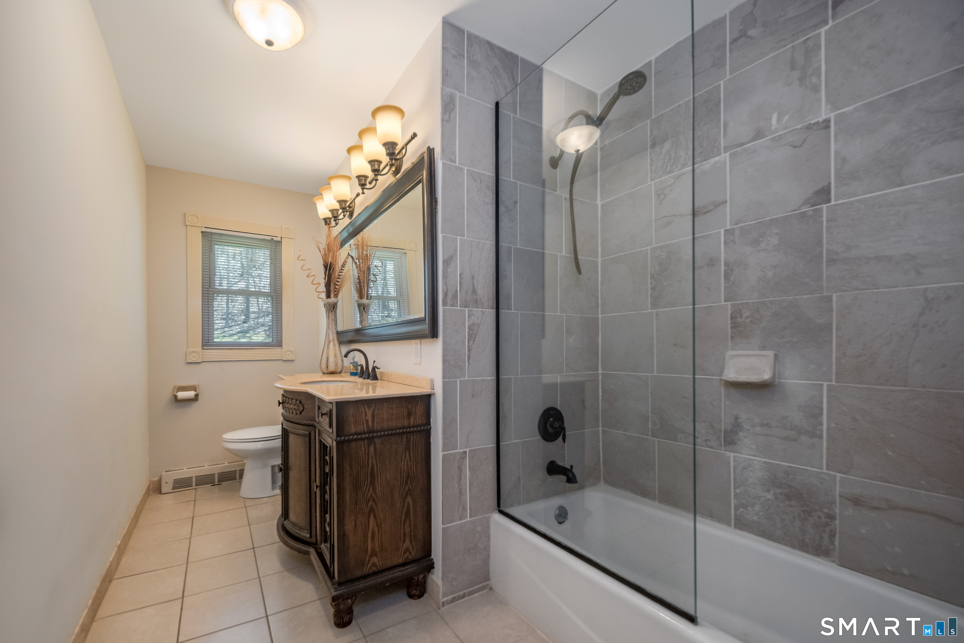 408 R Stage Coach Road Durham, CT 06422 - Photo 26 of 40 a bathroom with a sink a toilet and shower