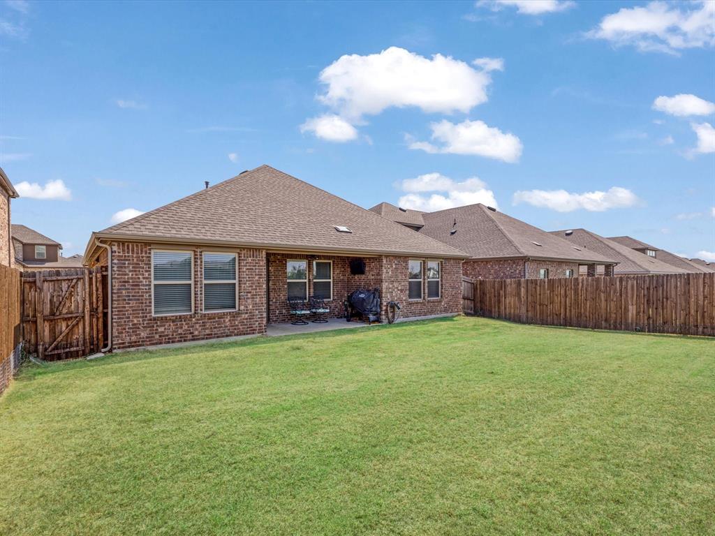 3257 Trails End Road Aubrey, TX 76227 - Photo 11 of 37 a view of a house with a yard and a garden