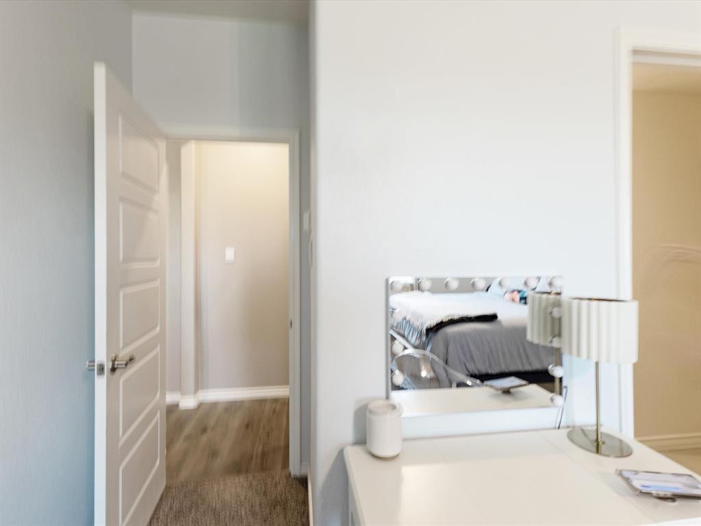 3257 Trails End Road Aubrey, TX 76227 - Photo 15 of 37 a bedroom with a bed and a chair