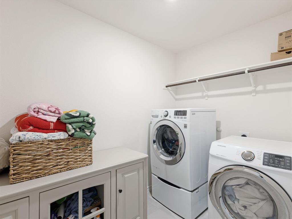 3257 Trails End Road Aubrey, TX 76227 - Photo 21 of 37 a utility room with dryer and washer