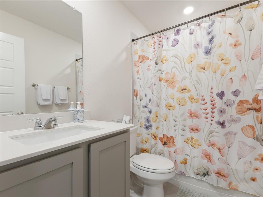 3257 Trails End Road Aubrey, TX 76227 - Photo 23 of 37 a bathroom with a sink and a mirror