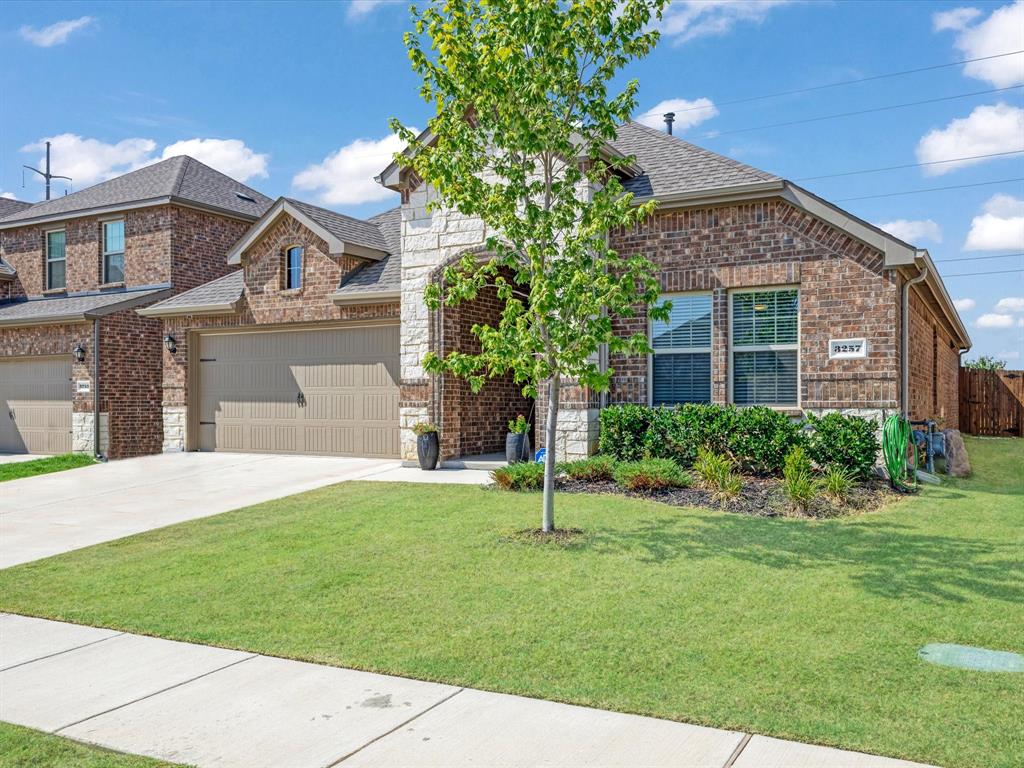 3257 Trails End Road Aubrey, TX 76227 - Photo 27 of 37 a front view of a house with a garden