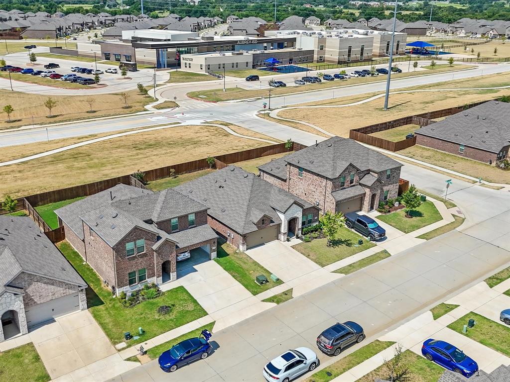 3257 Trails End Road Aubrey, TX 76227 - Photo 29 of 37 a view of residential houses with outdoor space and parking