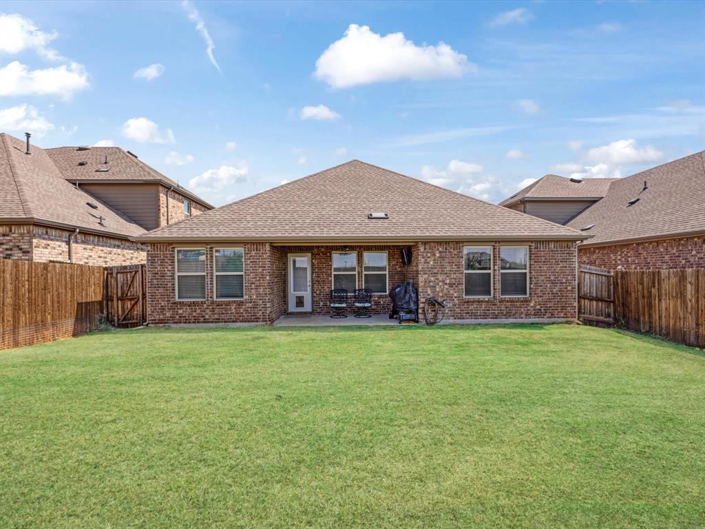 3257 Trails End Road Aubrey, TX 76227 - Photo 33 of 37 a view of a yard in front of a house