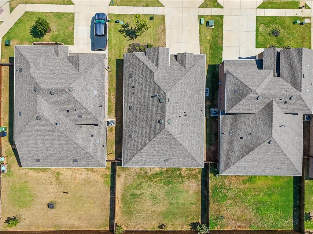 3257 Trails End Road Aubrey, TX 76227 - Photo 35 of 37 a aerial view of a house with a yard and wooden fence