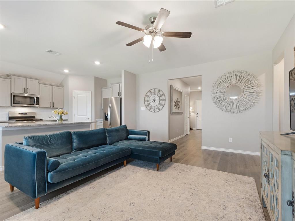 3257 Trails End Road Aubrey, TX 76227 - Photo 5 of 37 a living room with furniture and a kitchen view