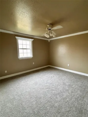 an empty room with a empty space and windows