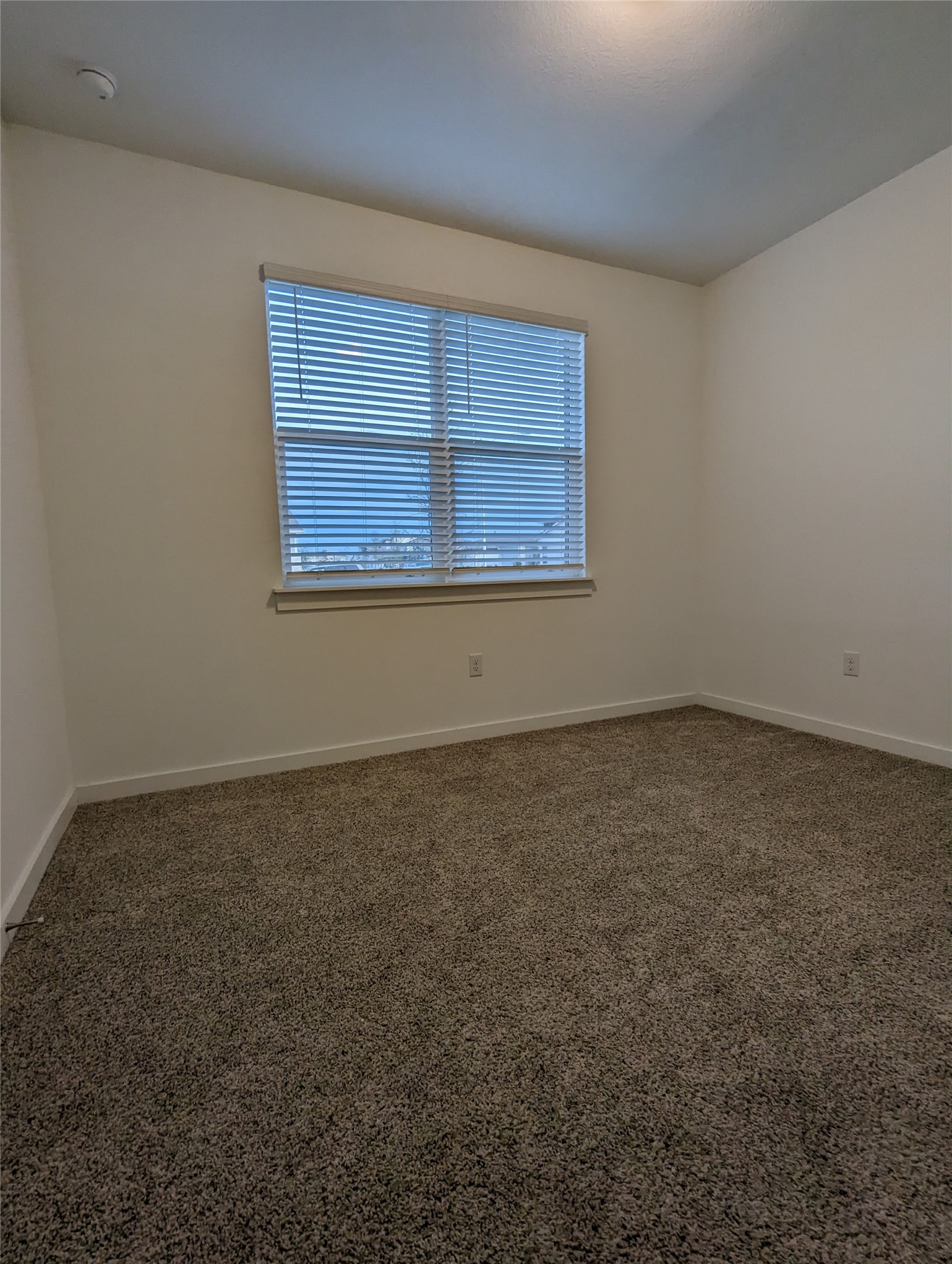 13804 Clerk Street Pflugerville, TX 78660 - Photo 11 of 14 an empty room with a window