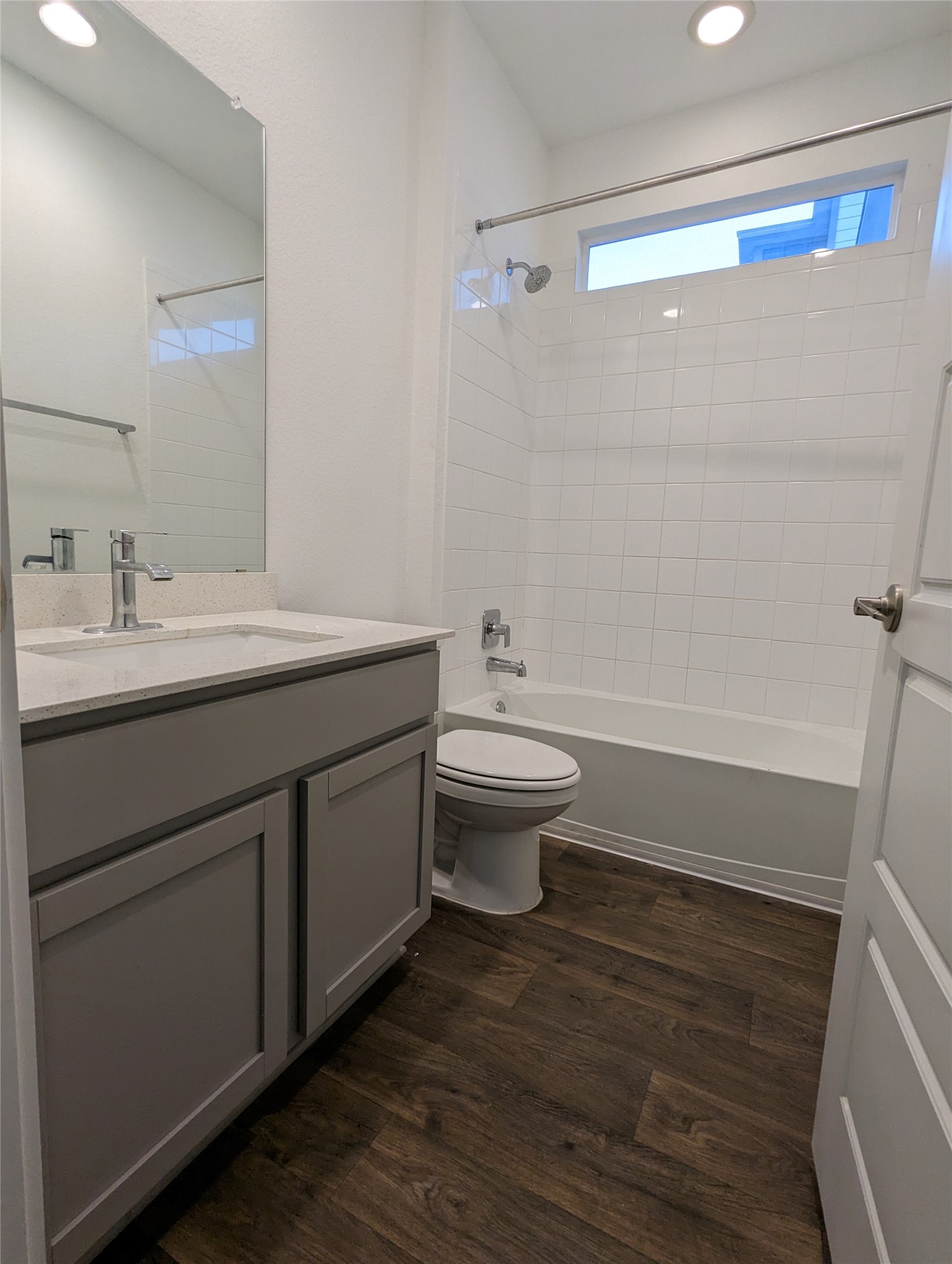 13804 Clerk Street Pflugerville, TX 78660 - Photo 12 of 14 a bathroom with a sink a toilet and shower
