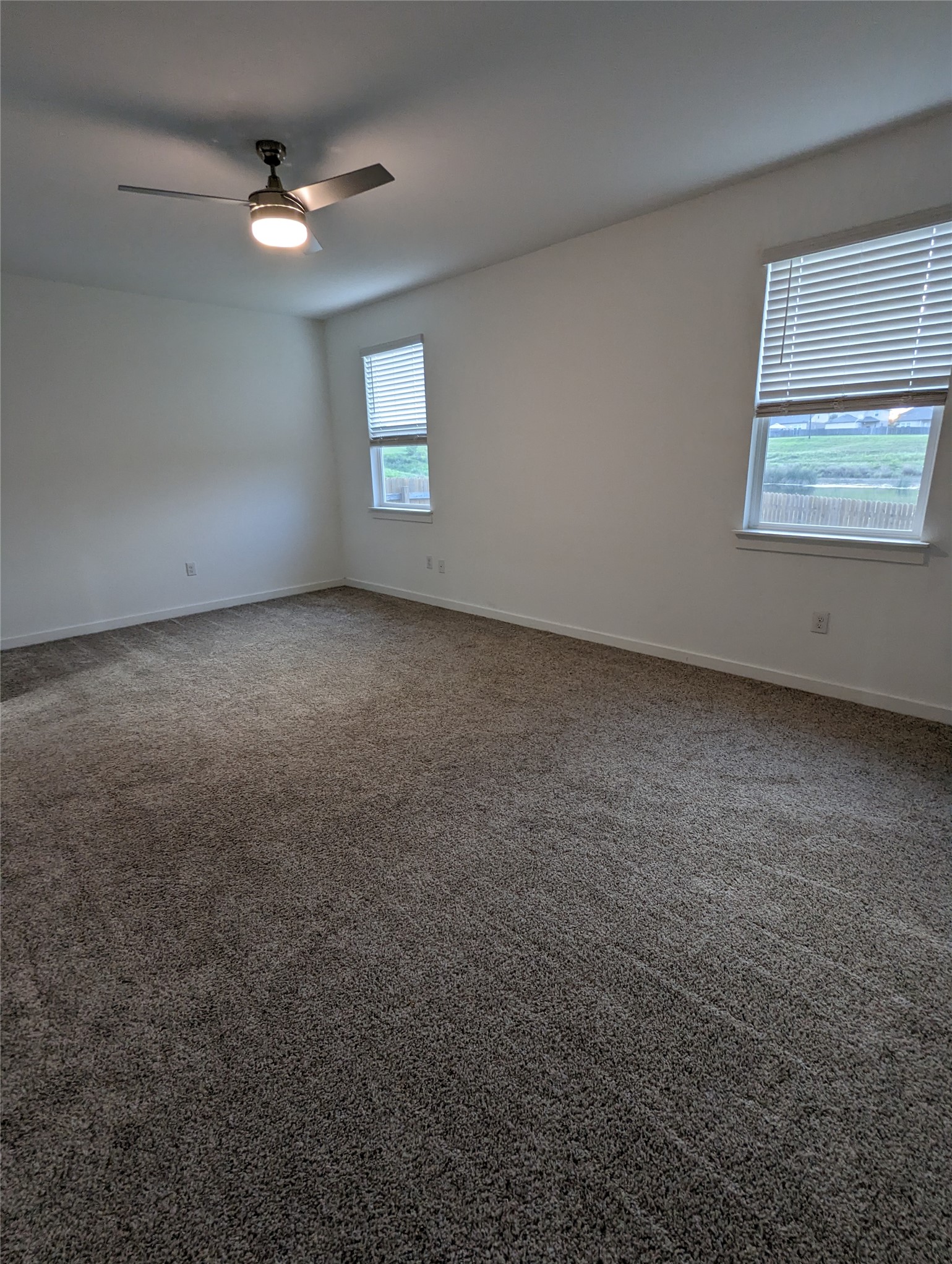 13804 Clerk Street Pflugerville, TX 78660 - Photo 5 of 14 an empty room with a window