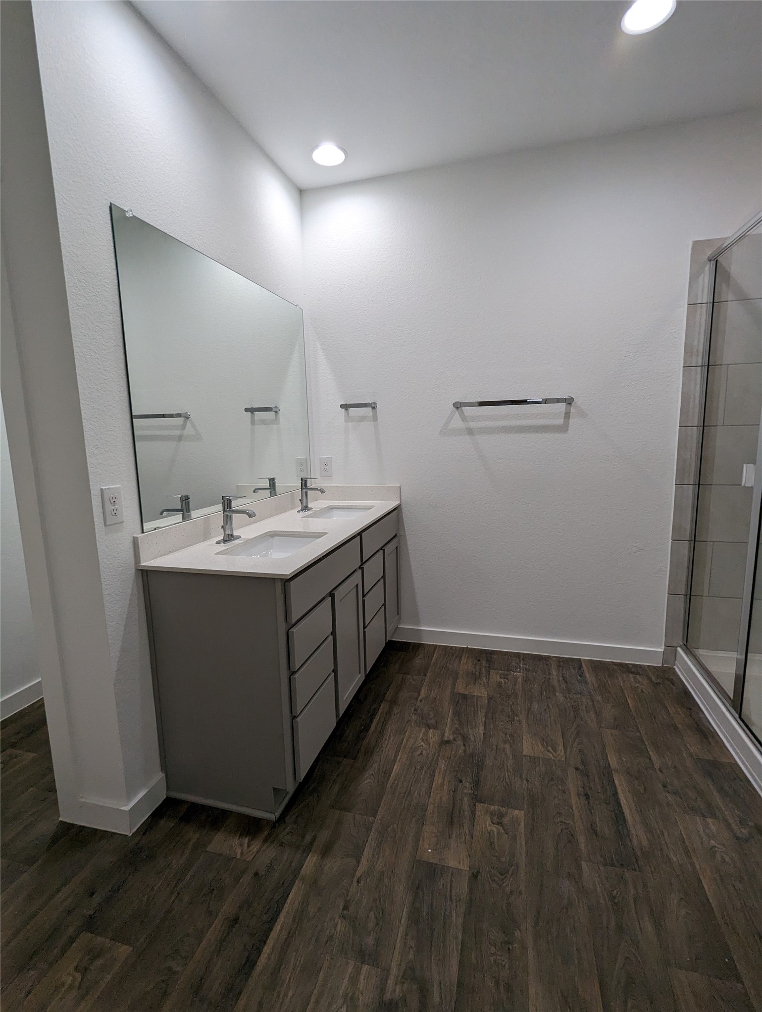 13804 Clerk Street Pflugerville, TX 78660 - Photo 8 of 14 a utility room with a sink a mirror and cabinets