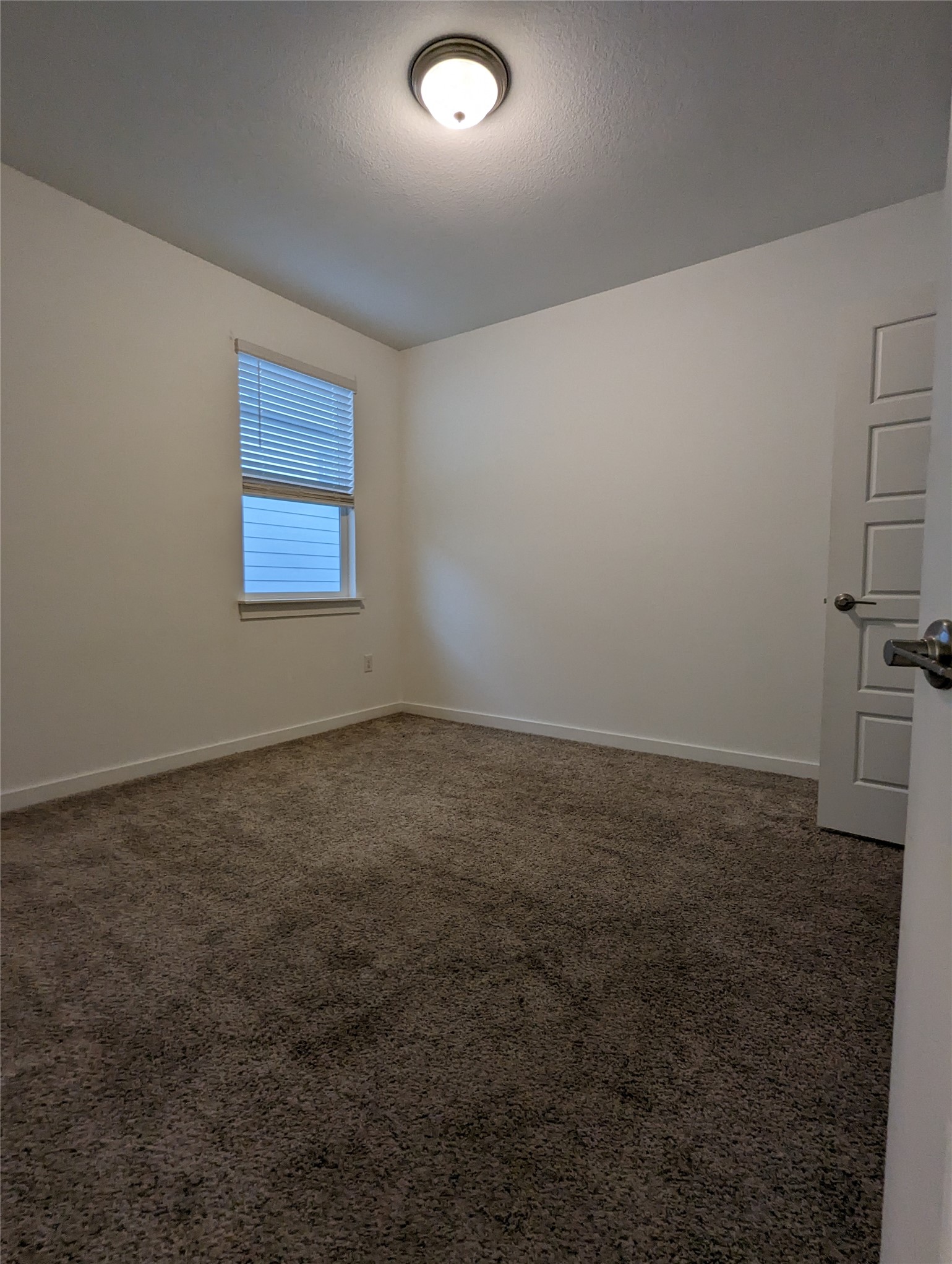 13804 Clerk Street Pflugerville, TX 78660 - Photo 10 of 14 an empty room with a empty space and windows