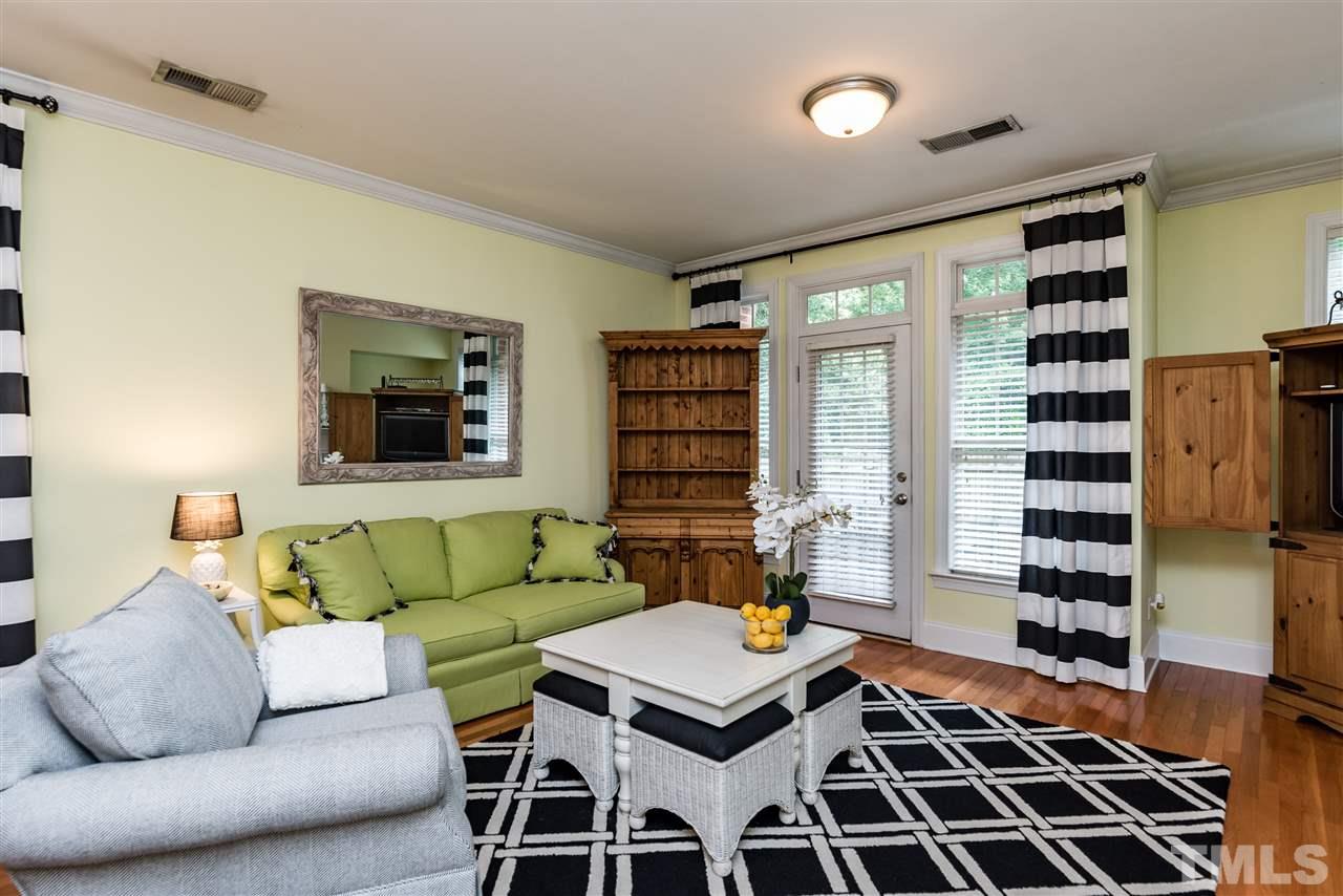 631 Highpark Lane Raleigh, NC 27608 - Photo 14 of 25 a living room with furniture and a rug