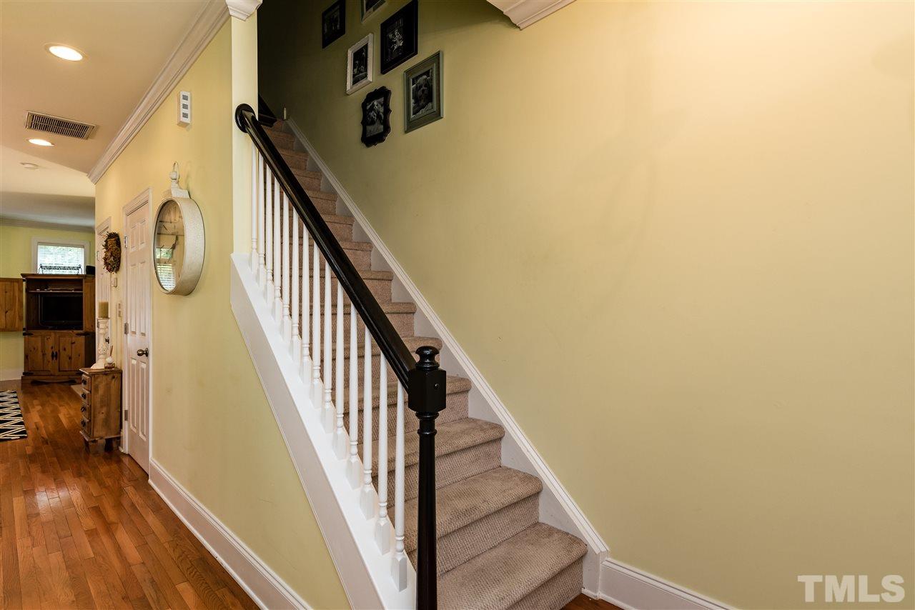 631 Highpark Lane Raleigh, NC 27608 - Photo 3 of 25 a view of entryway and hall with wooden floor