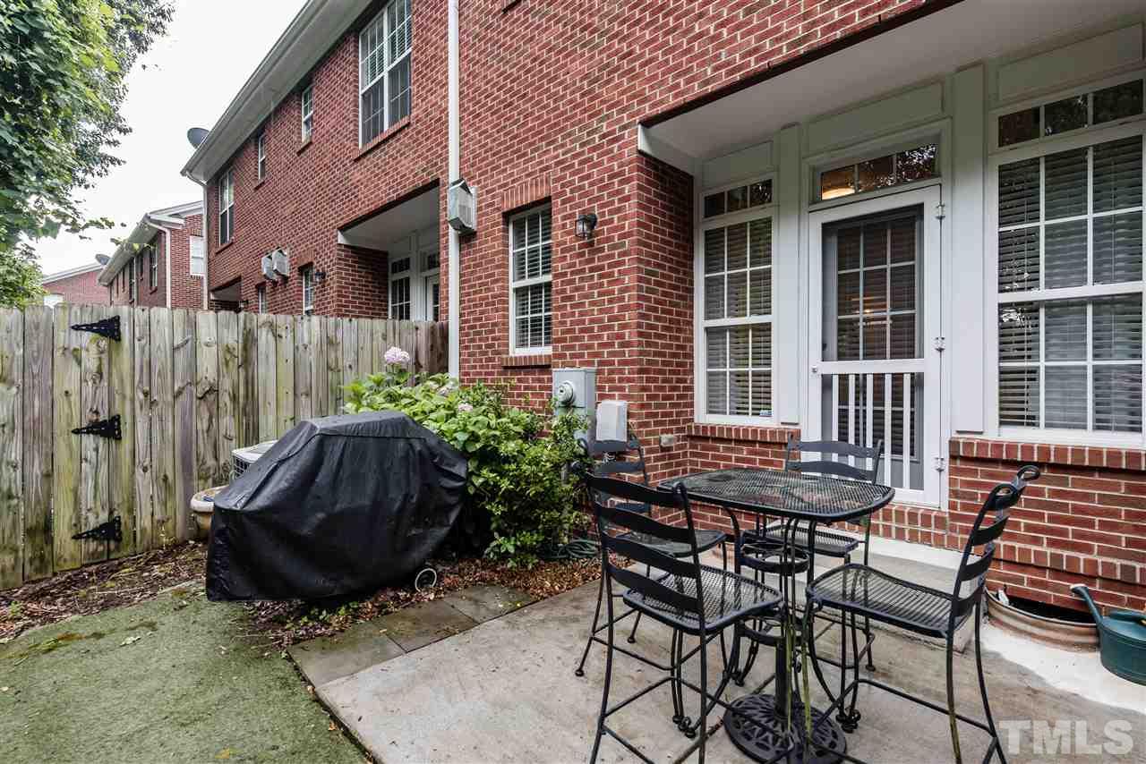 631 Highpark Lane Raleigh, NC 27608 - Photo 22 of 25 a view of a chair and table in the patio