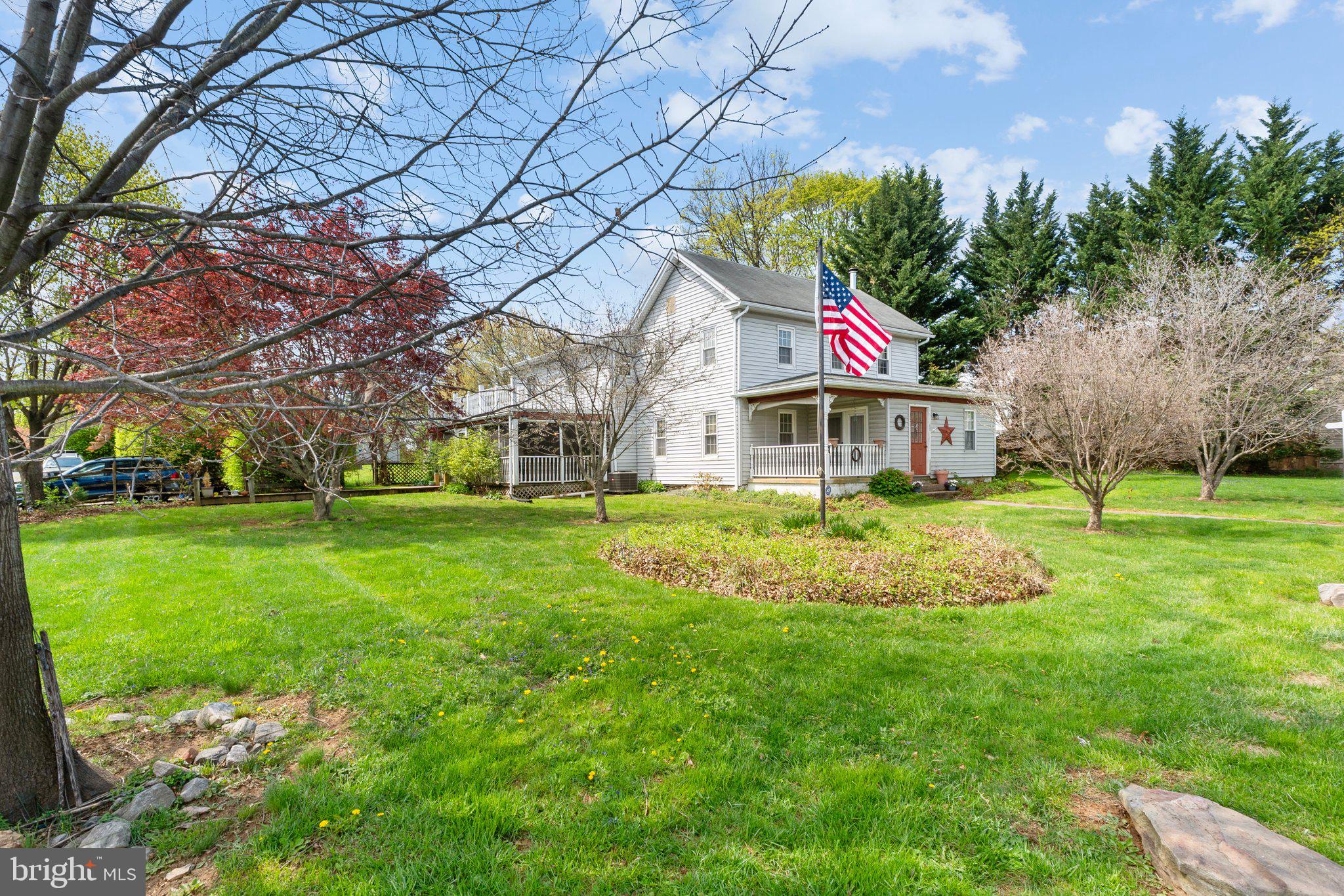 15921 Frederick Road Woodbine, MD 21797 - Photo 4 of 41 Charming home with vibrant greenery.