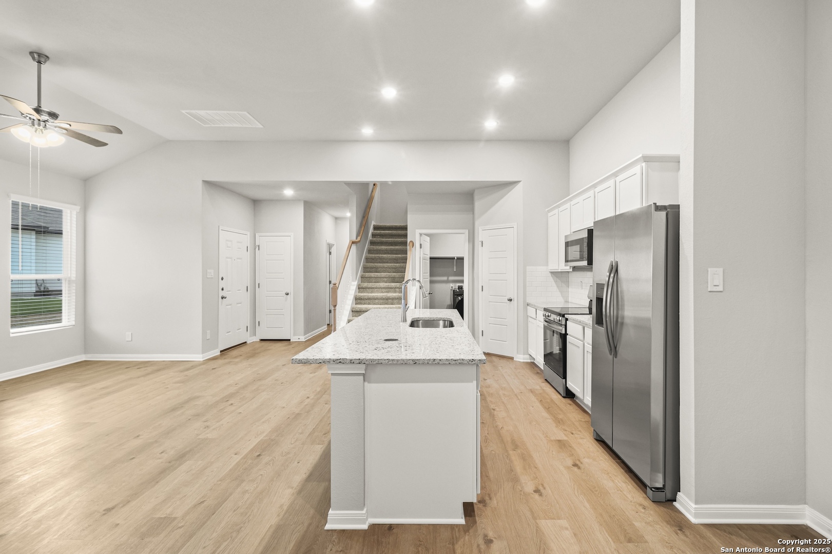 418 Cross Barn Boulevard, Unit B Buda, TX 78610 - Photo 12 of 35 a view of a kitchen with refrigerator and windows