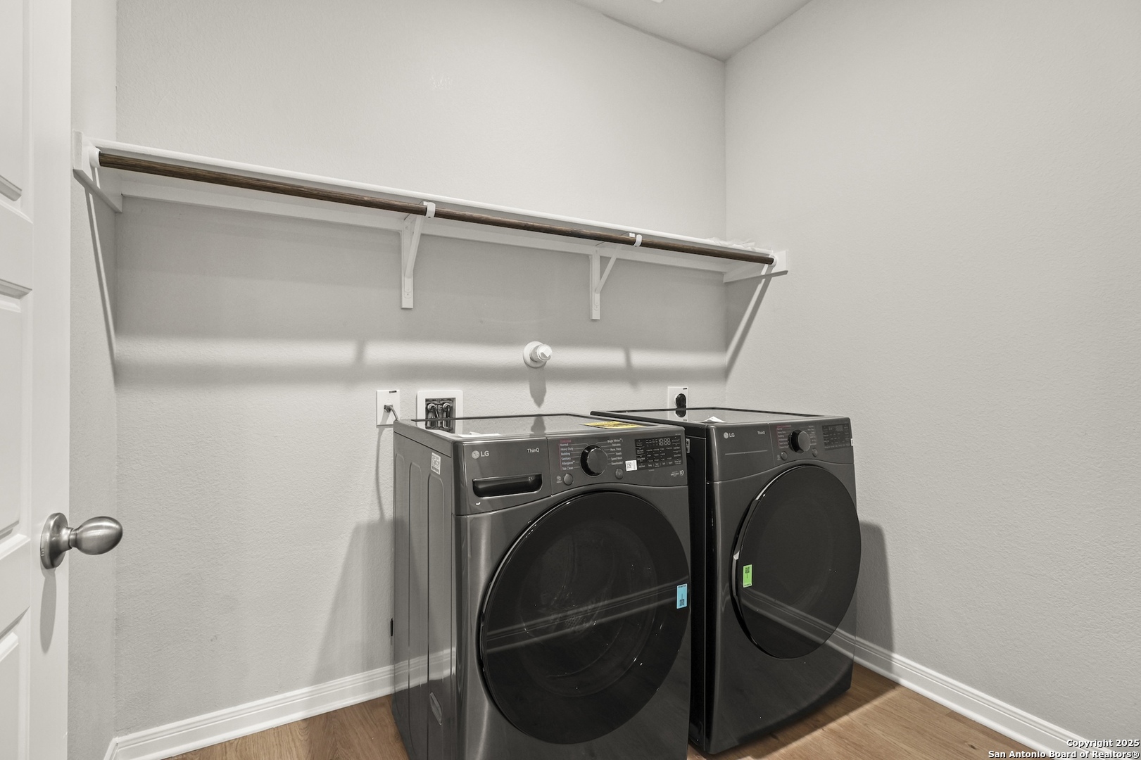 418 Cross Barn Boulevard, Unit B Buda, TX 78610 - Photo 16 of 35 a utility room with dryer and washer