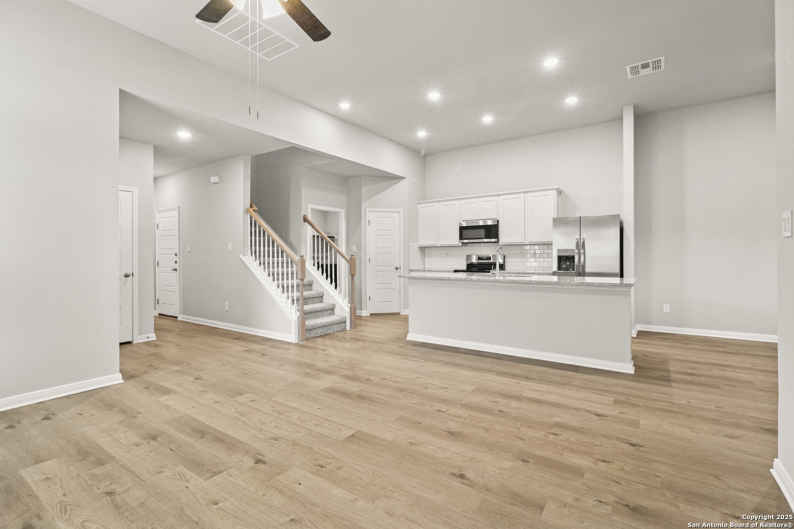 418 Cross Barn Boulevard, Unit B Buda, TX 78610 - Photo 2 of 35 a view of kitchen with microwave and cabinets