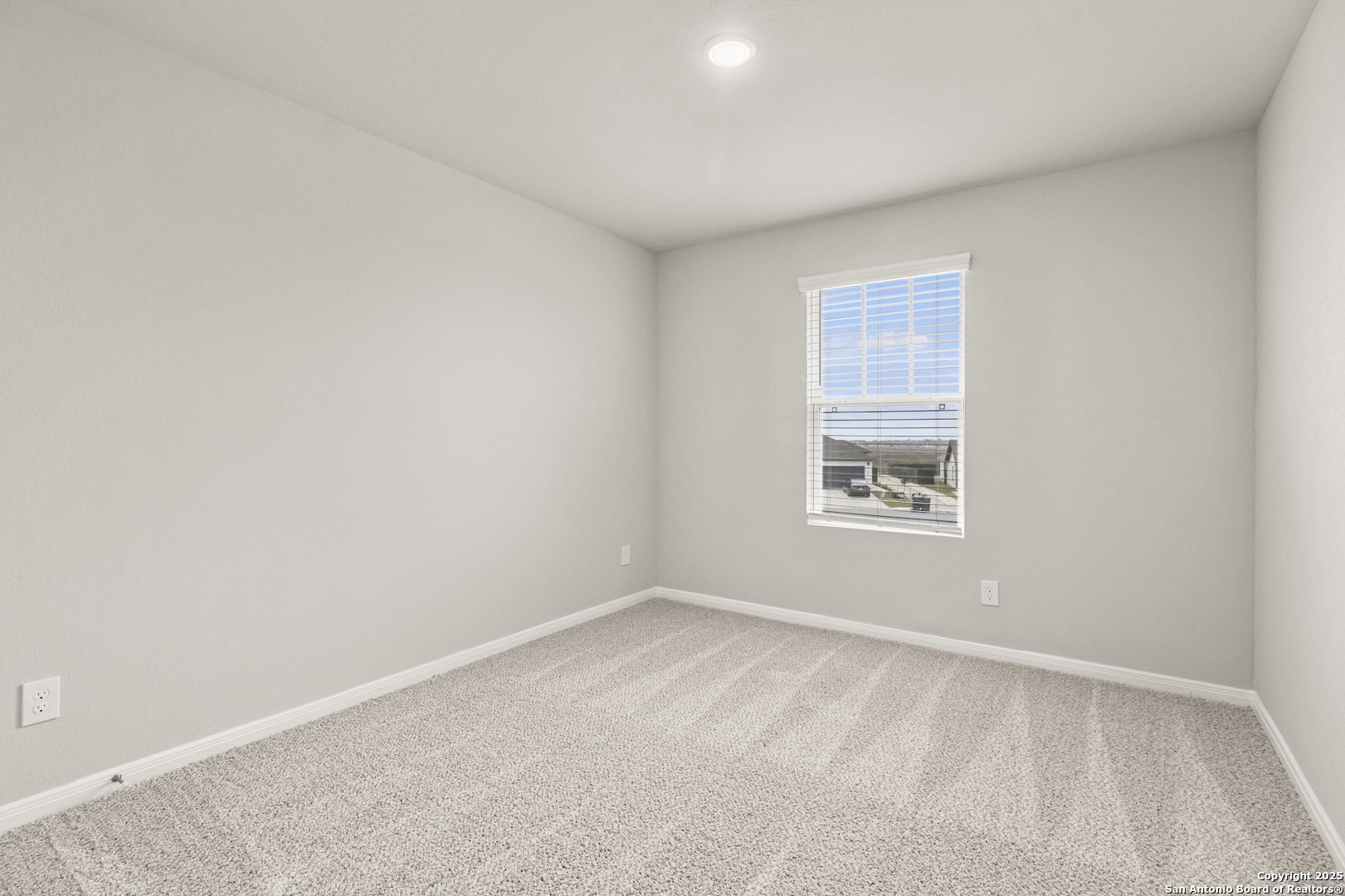 418 Cross Barn Boulevard, Unit B Buda, TX 78610 - Photo 26 of 35 an empty room with a window