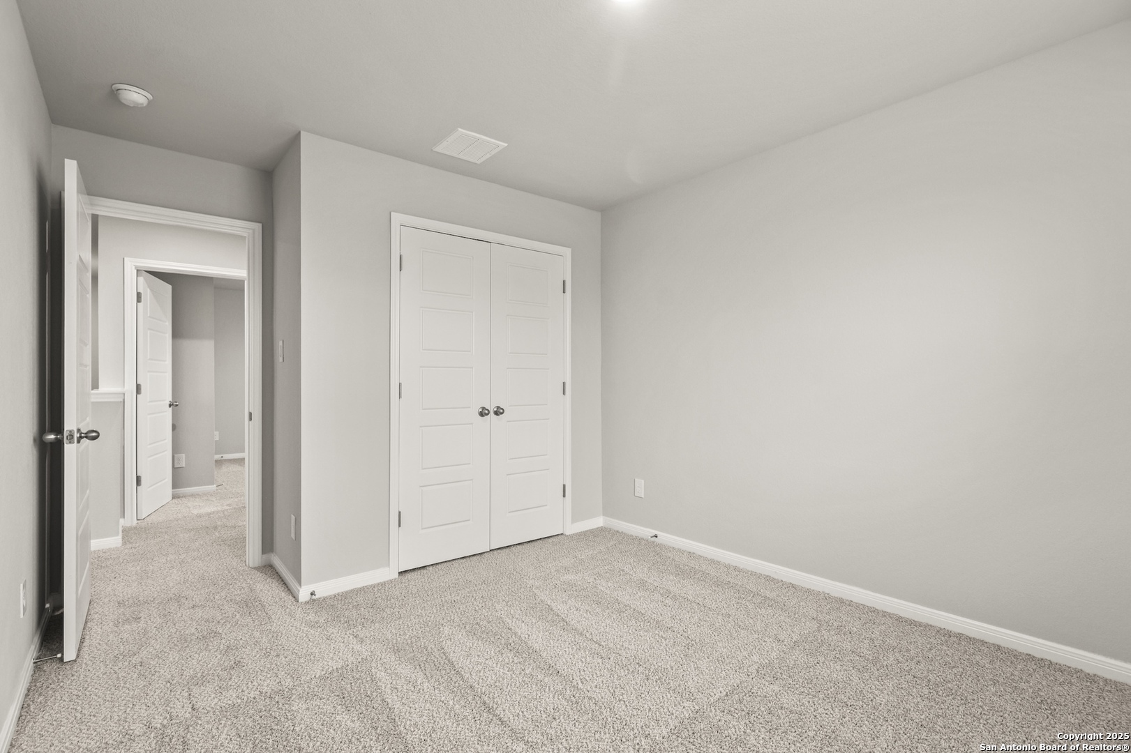 418 Cross Barn Boulevard, Unit B Buda, TX 78610 - Photo 27 of 35 an empty room with closet area