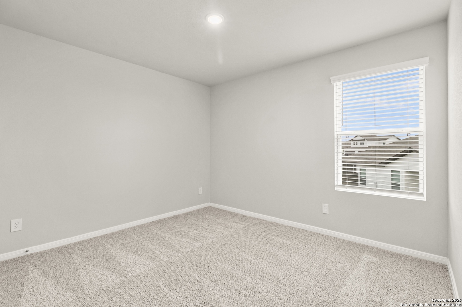 418 Cross Barn Boulevard, Unit B Buda, TX 78610 - Photo 29 of 35 an empty room with a window