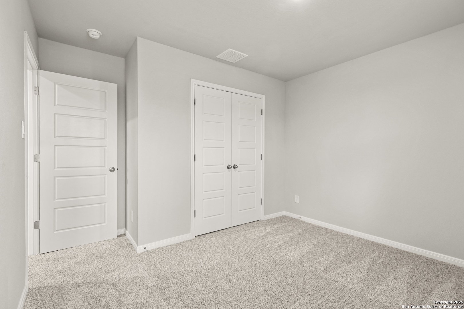 418 Cross Barn Boulevard, Unit B Buda, TX 78610 - Photo 30 of 35 an empty room with closet area