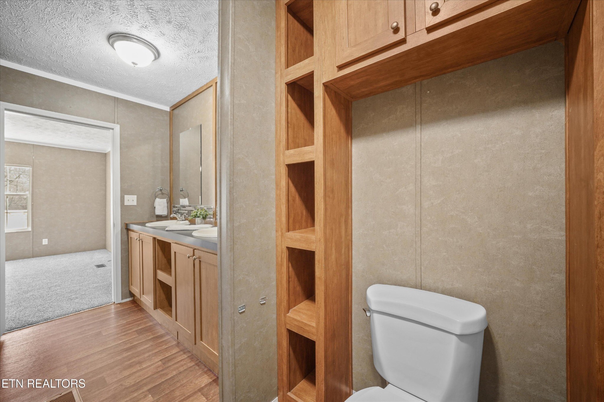 603 Bays Mountain Road Knoxville, TN 37920 - Photo 14 of 30 a bathroom with a granite countertop toilet sink and mirror